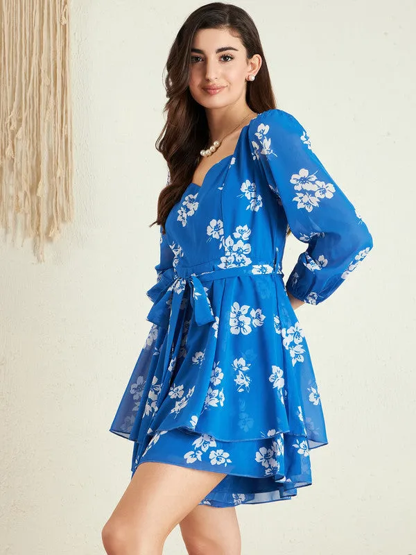 Berrylush Women Blue & White Floral Printed Sweetheart Neck Puff Sleeves Tie-Up Waist Layered Mini Jumpsuit