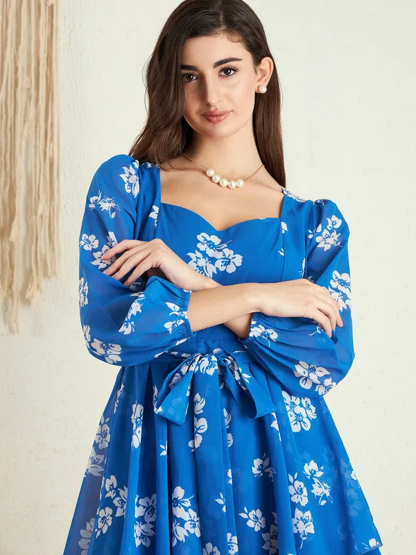 Berrylush Women Blue & White Floral Printed Sweetheart Neck Puff Sleeves Tie-Up Waist Layered Mini Jumpsuit