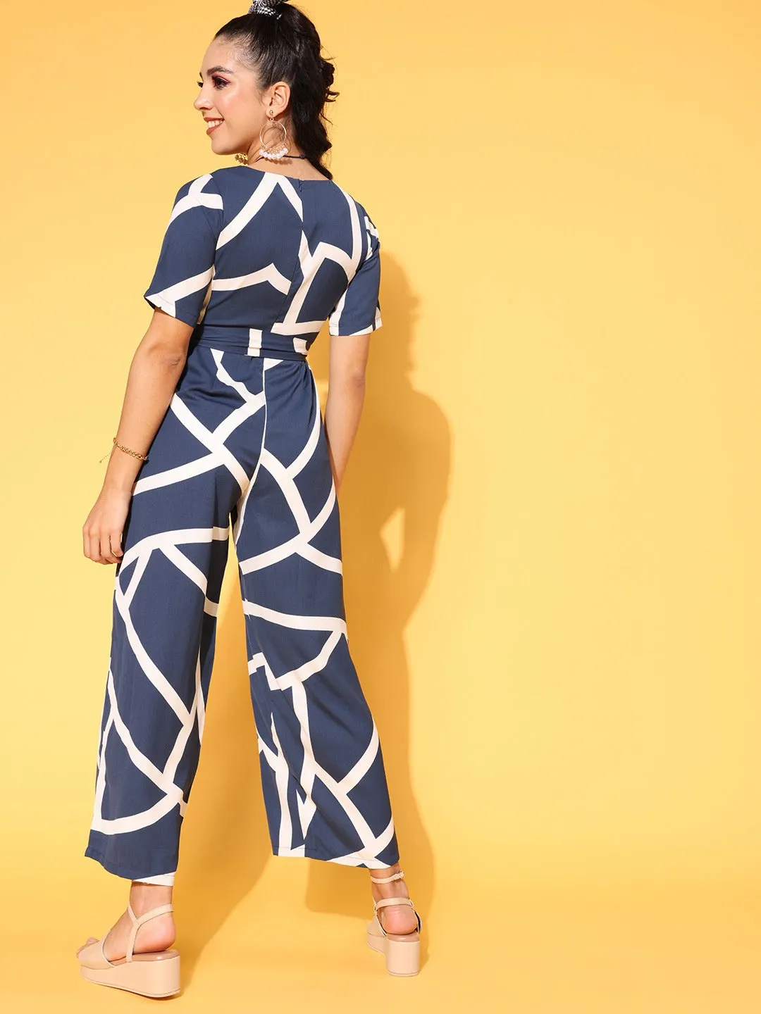 Berrylush Women Navy Blue & White Geometric Printed Round Neck Tie-Up Waist Wide Leg Regular Jumpsuit